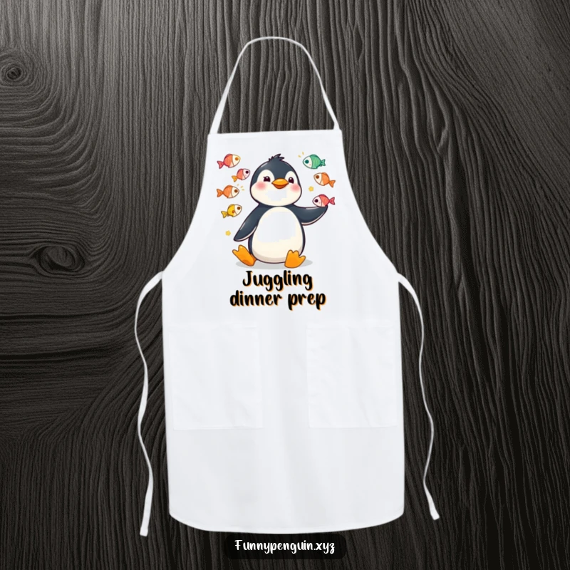 Funny apron featuring a kawaii penguin juggling a colorful array of fish with big, funny motions.
